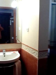 a bathroom with a sink and a mirror at 2 bedrooms house with enclosed garden and wifi at Aljezur 8 km away from the beach in Aljezur
