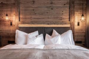 Postel nebo postele na pokoji v ubytování Hotel Niblea Dolomites