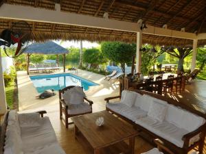 Pogled na bazen u objektu 2 bedrooms bungalow with sea view shared pool and enclosed garden at Andilana ili u blizini