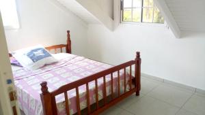 A bed or beds in a room at Appartement d'une chambre avec jardin amenage et wifi a Capesterre de Marie Galante a 4 km de la plage