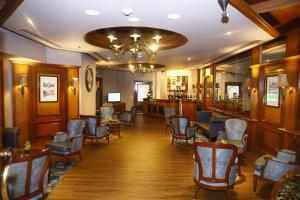 a bar in a restaurant with chairs and tables at Welcomhotel by ITC Hotels, Devee Grand Bay, Visakhapatnam in Visakhapatnam