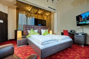 TV a/nebo společenská místnost v ubytování Genusshotel Wenisch