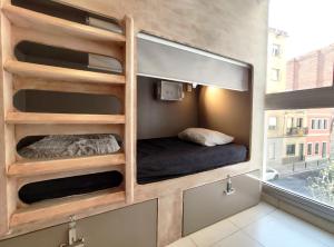 
a bunk bed in a room with a window at Hostel One Sants in Barcelona
