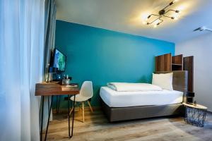 Postel nebo postele na pokoji v ubytování Genusshotel Wenisch