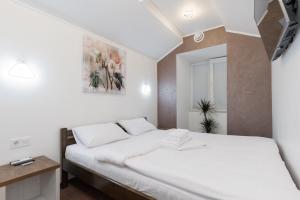 Posteľ alebo postele v izbe v ubytovaní Apartments on Chaykovskogo 16