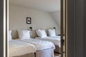 Postel nebo postele na pokoji v ubytování Hoeve Hazegras