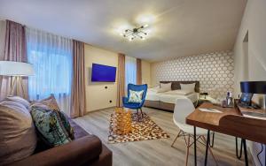 TV a/nebo společenská místnost v ubytování Genusshotel Wenisch
