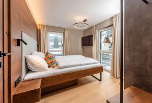 Łóżko lub łóżka w pokoju w obiekcie Appartements Wehrhof by Schladmingurlaub