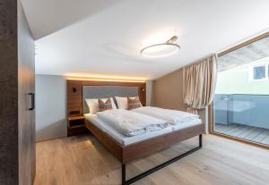 Łóżko lub łóżka w pokoju w obiekcie Appartements Wehrhof by Schladmingurlaub