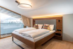 Łóżko lub łóżka w pokoju w obiekcie Appartements Wehrhof by Schladmingurlaub