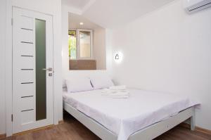 Posteľ alebo postele v izbe v ubytovaní Apartments on Chaykovskogo 16