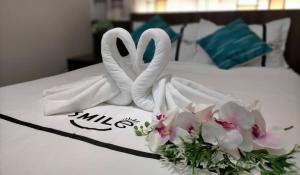 Postel nebo postele na pokoji v ubytování Smile Hotel Cheras Pudu KL