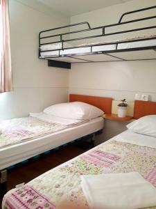 Ένα ή περισσότερα κρεβάτια σε δωμάτιο στο Camp Sibuljina