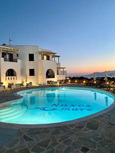 a large swimming pool in front of a building at Naxos Mare in Agia Anna Naxos