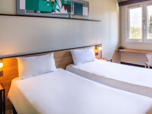 Кровать или кровати в номере ibis Mendoza