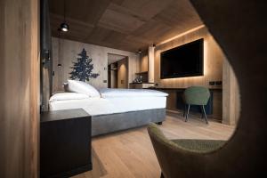 Postel nebo postele na pokoji v ubytování Hotel Cappella