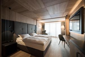 Postel nebo postele na pokoji v ubytování Hotel Cappella