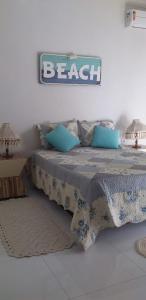 Postelja oz. postelje v sobi nastanitve Recanto da Orla - apartamento lindo e aconchegante - 2 Quartos