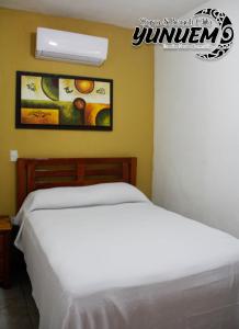 Postel nebo postele na pokoji v ubytování Casa & Beach Club Yunuem