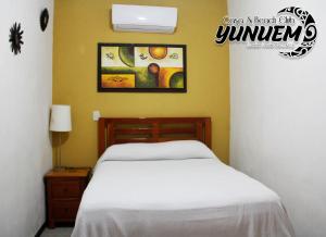 Postel nebo postele na pokoji v ubytování Casa & Beach Club Yunuem