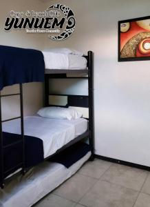 Postel nebo postele na pokoji v ubytování Casa & Beach Club Yunuem
