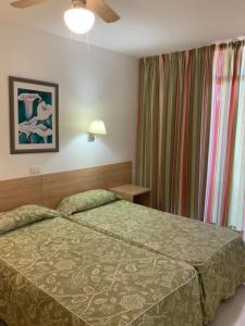 A bed or beds in a room at Apartamentos Maspalomas Foresta