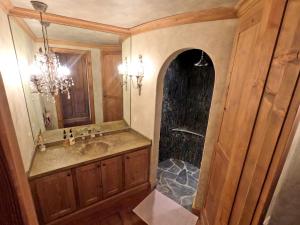 a bathroom with a sink and a shower at Beautiful apartment over the mountain in Crans-Montana +15 photos