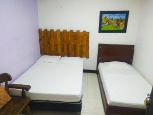 Postel nebo postele na pokoji v ubytování Hotel B & C