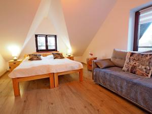 Ένα ή περισσότερα κρεβάτια σε δωμάτιο στο Pokoje gościnne u Basi