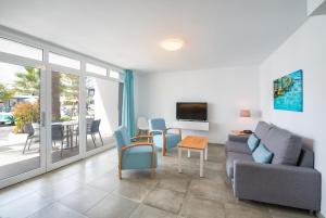 TV a/nebo společenská místnost v ubytování Apartamentos Playamar