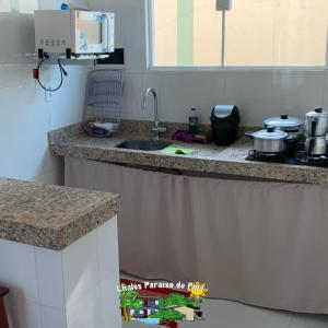Kjøkken eller kjøkkenkrok på Chalés Paraiso de Pipa