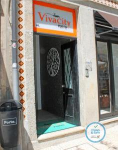 a revolving door in a building with a trash can at Vivacity Porto - Rooms & Apartments in Porto