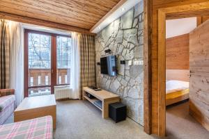 Ein Bett oder Betten in einem Zimmer der Unterkunft Kukučka Lomnica - Tatranská Lomnica