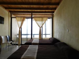Postel nebo postele na pokoji v ubytování Hotel Restaurante Rocío by Rotamundos