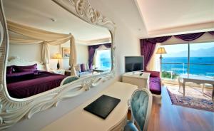 a hotel room with a bed and a large mirror at Prime Boutique Hotel in Antalya