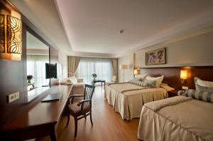 Ein Bett oder Betten in einem Zimmer der Unterkunft Prime Boutique Hotel