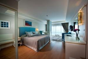 Ein Bett oder Betten in einem Zimmer der Unterkunft Prime Boutique Hotel