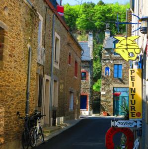 a bike parked on the side of a street at STUDIO CANCALE - PORT DE LA HOULE - classé 2 étoiles in Cancale