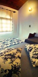 Ένα ή περισσότερα κρεβάτια σε δωμάτιο στο Pousada Em Busca do Sol