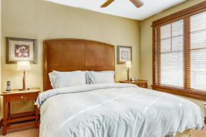 a bedroom with a large bed with a wooden headboard at Northstar Village #410 in Kingswood Estates