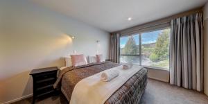 Postel nebo postele na pokoji v ubytování Alpine Resort Wanaka THC Hotels and Resorts + 24 fotografií