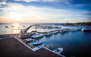 a group of boats docked in a marina at Strand Öland in Borgholm +6 photos