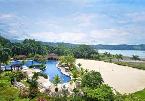 an aerial view of a resort with a beach at Ocean View Condo in Los Sueños in Herradura