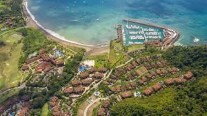 an aerial view of a resort near the ocean at Ocean View Condo in Los Sueños in Herradura