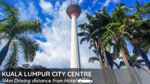 a view of the kuala lumpur city centre tower with palm trees at Seeds Hotel Wangsa Maju in Kuala Lumpur +22 photos