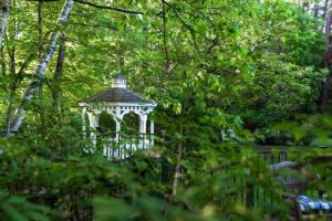 a gazebo in the middle of a garden at Inn on Putney Road in Brattleboro