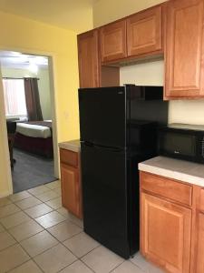 A kitchen or kitchenette at Europa Inn & Suites