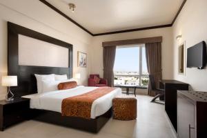 Ramada by Wyndham Karachi Creek客房内的一张或多张床位