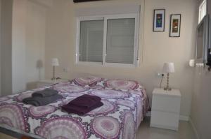A bed or beds in a room at Nice Flat -200m Center-2 Baths- 3 Bedrooms 5pers