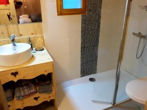 a bathroom with a sink and a shower at Chambre d'Hôtes Kiki & Coco in Saint-Jean-de-Maurienne +17 photos